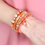 RIAH FASHION Bohemian Mix Bead Multi Layer Versatile Statement Bracelets – Stackable Beaded Strand Stretch Bangles Sparkly Crystal, Tassel Charm (Coral)